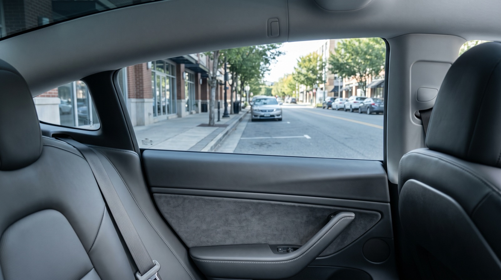 Car cabin seen through a side window with window tint applied